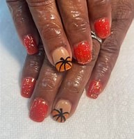Red glitter nails with basketball accent art